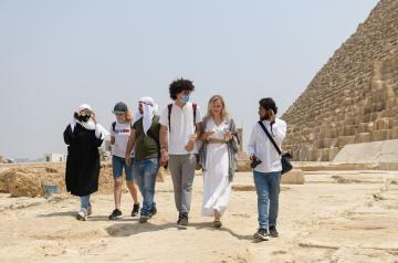 International students walking at the pyramids