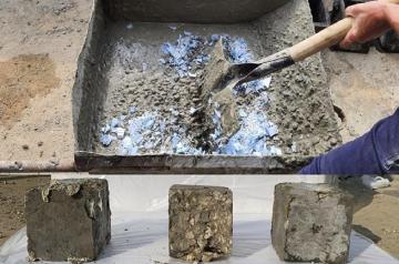 Mixing used masks and gloves and producing concrete
