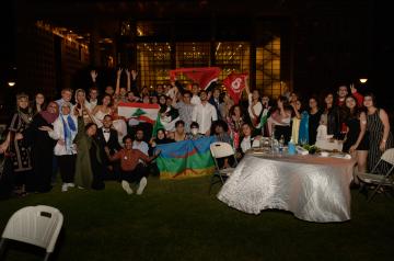 A group pf boys and girls with flag
