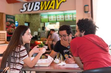 Students eating in a food court