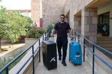Smiling boy with luggage