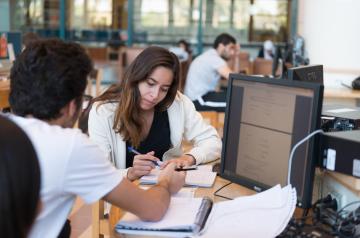 Boy and girl studying in the library