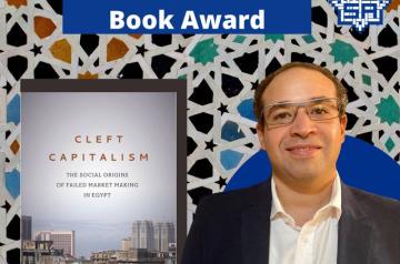 Amr Adly next to his book "Cleft Capitalism"