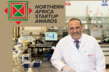Hassan Azzazy sitting in a lab