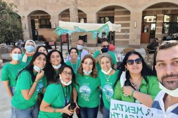Group of boys and girls wearing green t-shirts