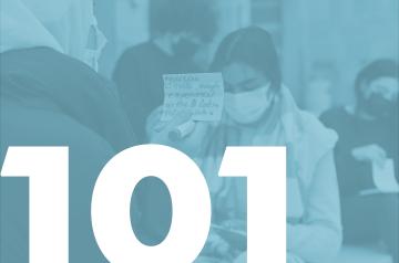 picture of a girl with a mask in the background with 101 written in white