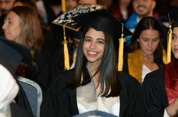 Female graduate at her commencement ceremony