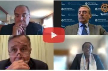 Four people talking in a video conference