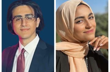 Male wearing glasses and a veiled female