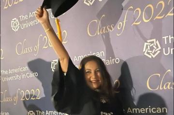 Graduating girl with cap and gown