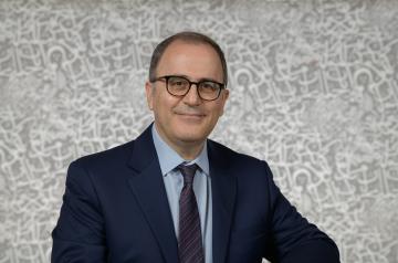 smiling man with suit and tie