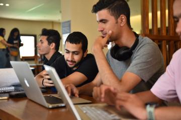 Boys sitting on laptop