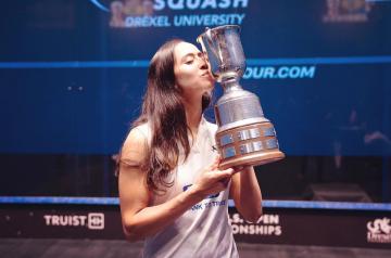 A female athlete kissing a trophy, squash, Drexel University, Truist