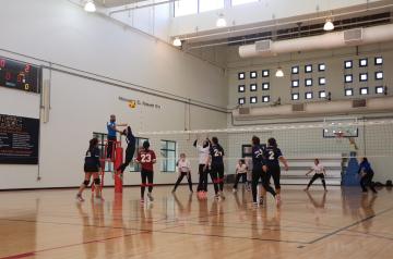Two teams playing a women's volley match, Mohamed El Rashidi Gym, AUC