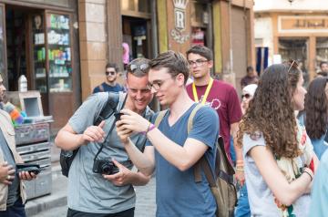two boys looking at a camera