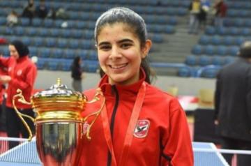 Female athlete holding a cup