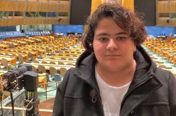 a boy in an auditorium