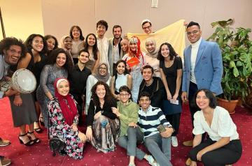 A group of girls and boys smiling