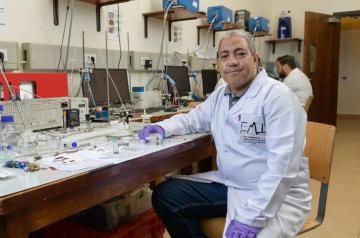 A scientist sitting in a lab