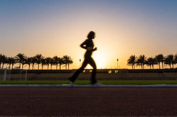 a girl running in the track