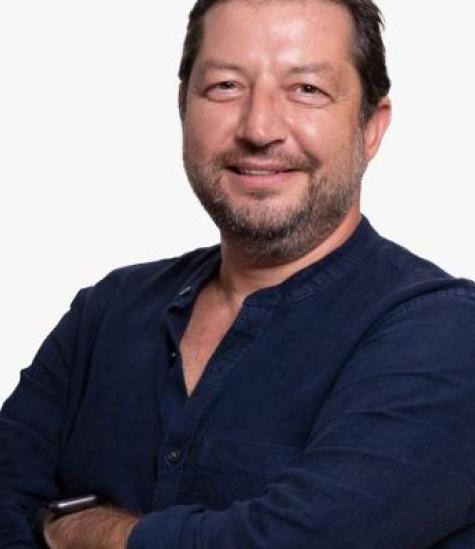 Man smiling his hands crossed
