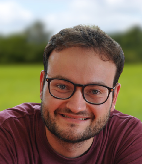 Cornelius smiles for a headshot