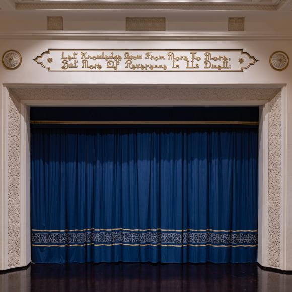 Ewart Hall stage with closed blue curtains