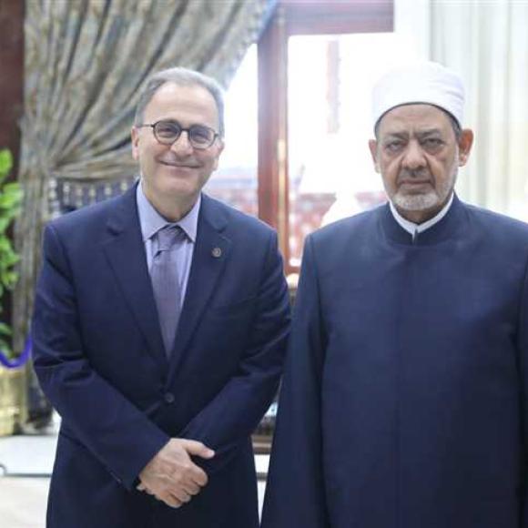 Two men standing in an office