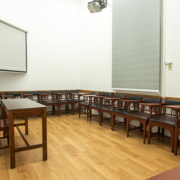 Chairs, tables and a board in a classroom