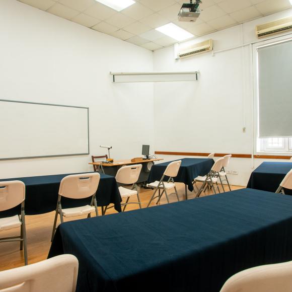 Chairs, tables, a computer and a board