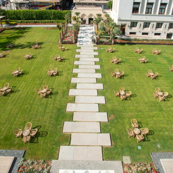 A garden with chairs and tables