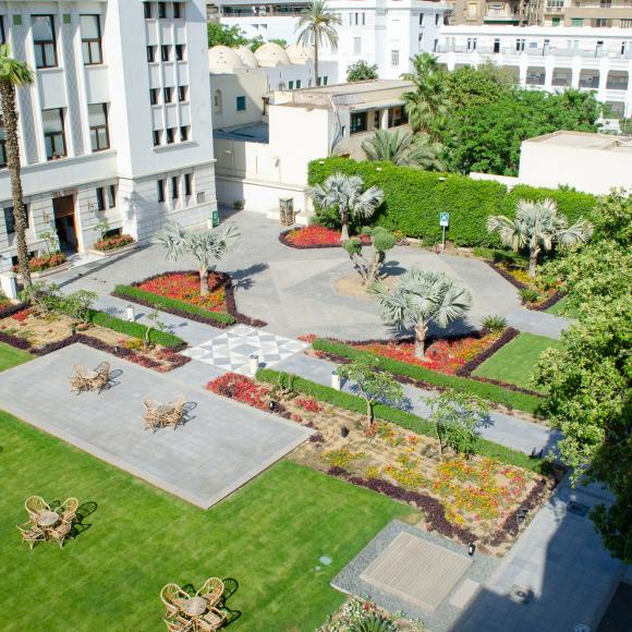 A garden with chairs and tables