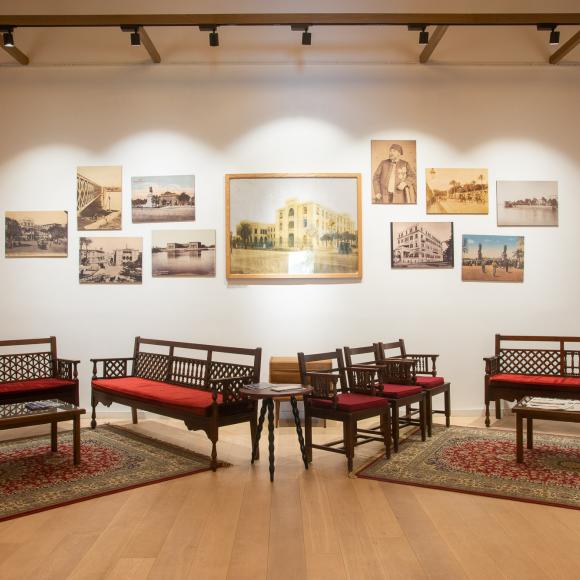 Seating area and paintings in a room