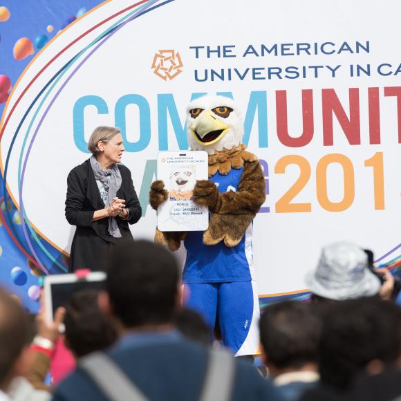 former auc president lisa anderson with mascot
