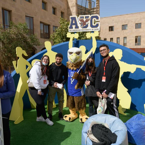 mascot with  auc students