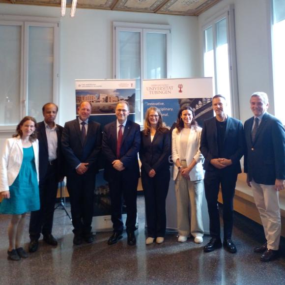 a group of people standing with president ahmad dallal