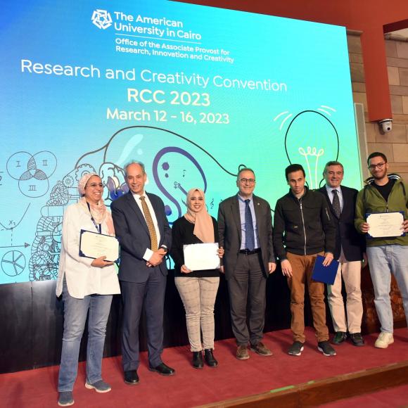 Group of people standing and holding certificates