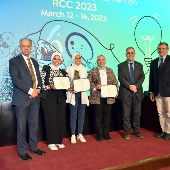 Group of people standing and holding certificates