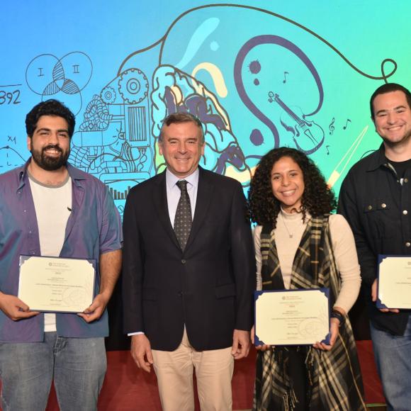 Group of people standing and holding certificates