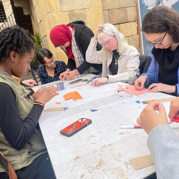 A group of students work on crafts at a table