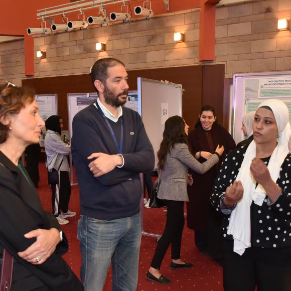 a winning student presenting the poster to judges