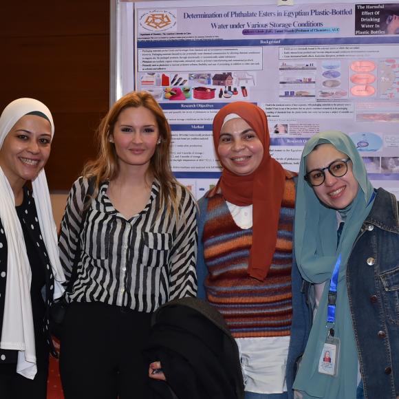 winning student in a group photo including Dr. Seham