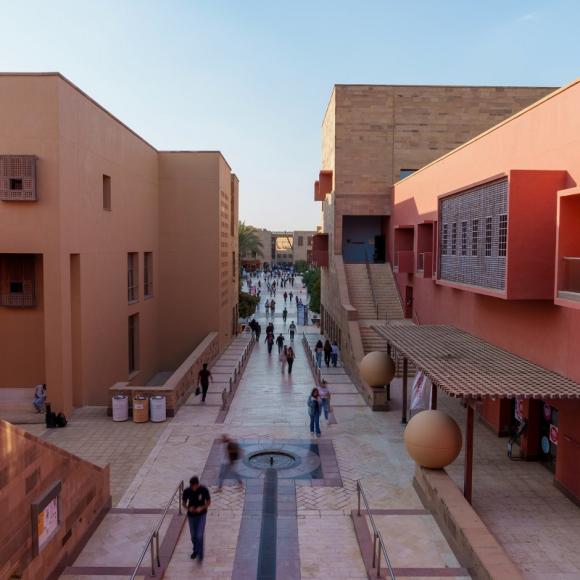 Males and females busy walking in the Plaza