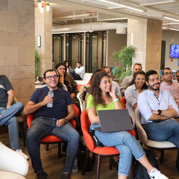 a group of people sitting together listening to a presentation at a workshop at AUC Innovation Hub