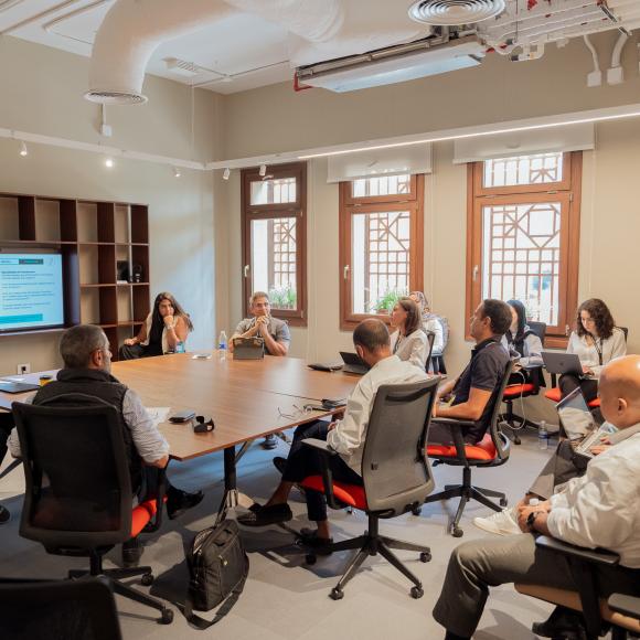 a group of students and industry partners attending a round table