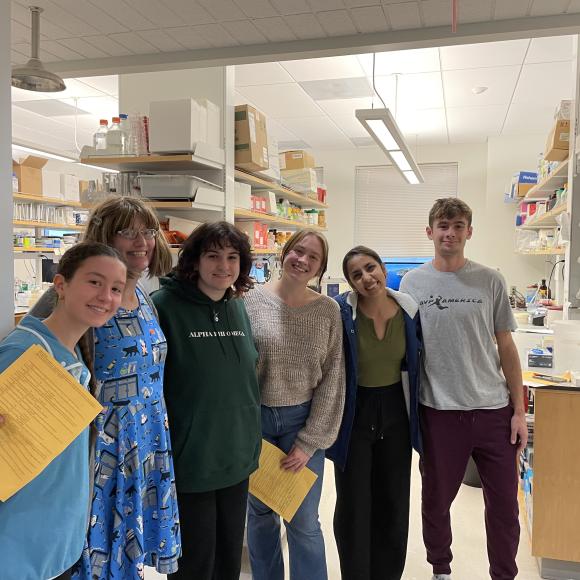 Husn with her colleagues at a lab