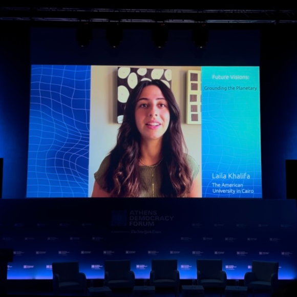 A photo of Laila Khalifa's video on a larger screen above the panelist's stage