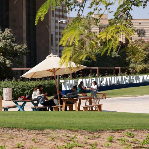 Friends sitting together on campus.