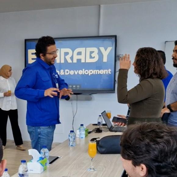 People standing and others are sitting. They are talking