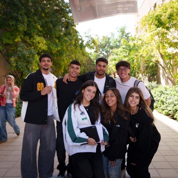 Students standing together and smiling